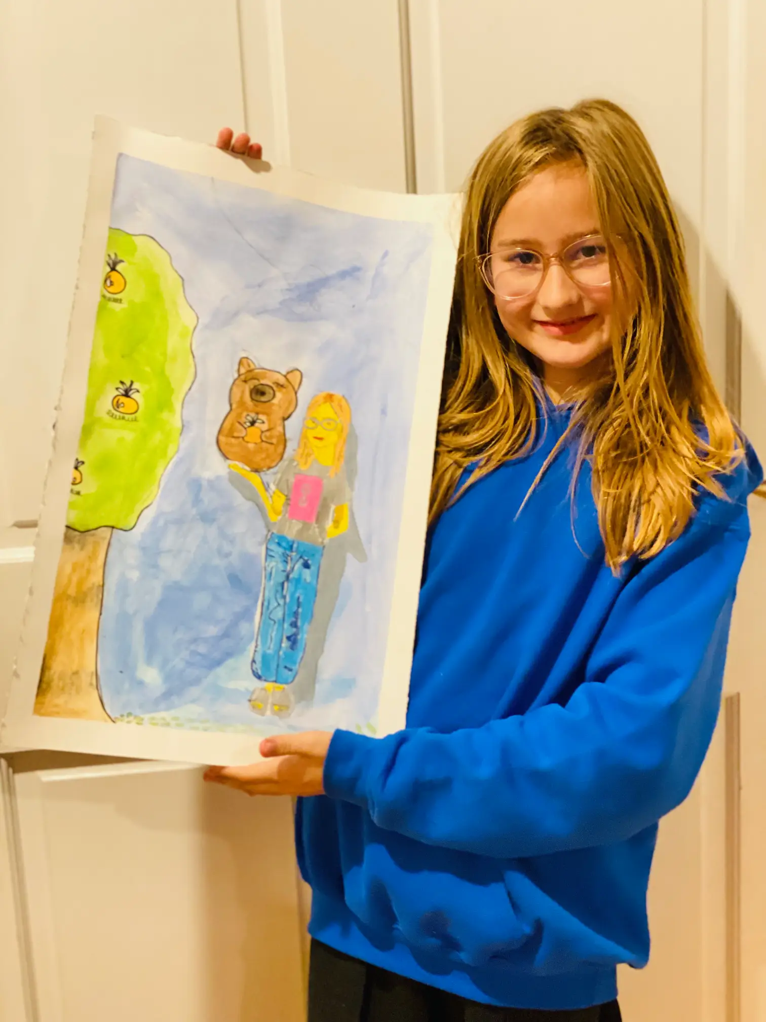 student shows off her art