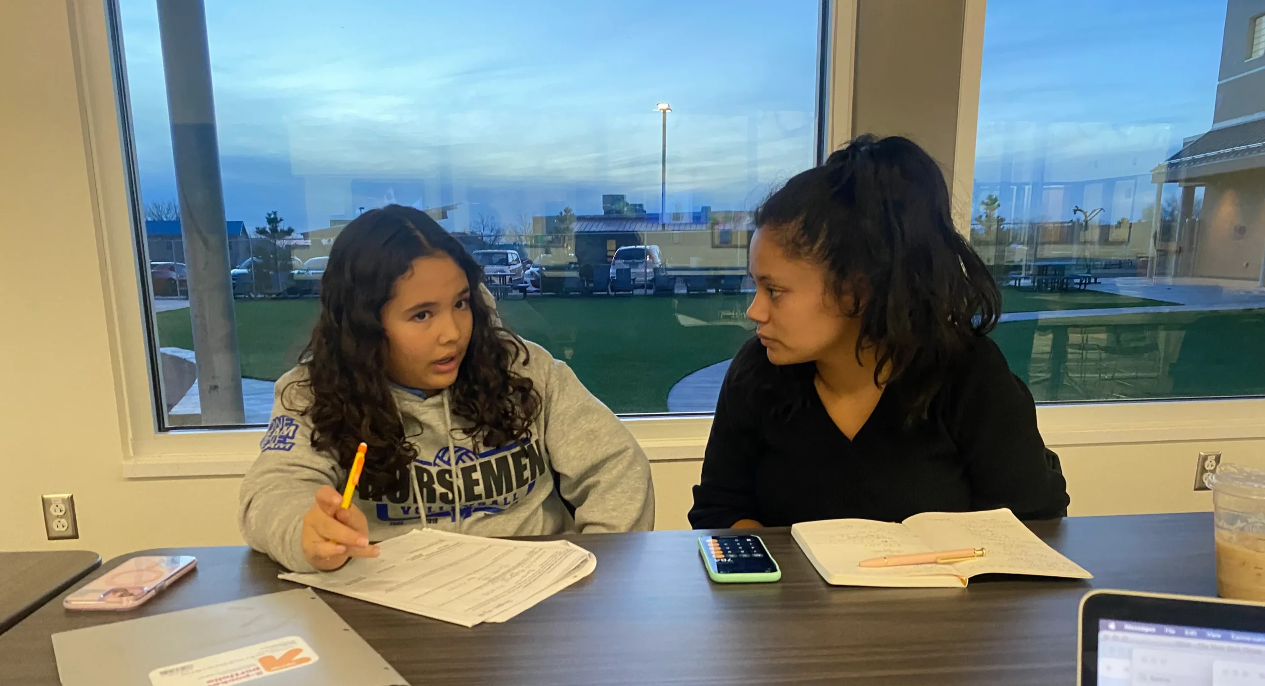 Courtesy photo: Tutor helping St. Michael’s middle school student prepare for final exam in math.