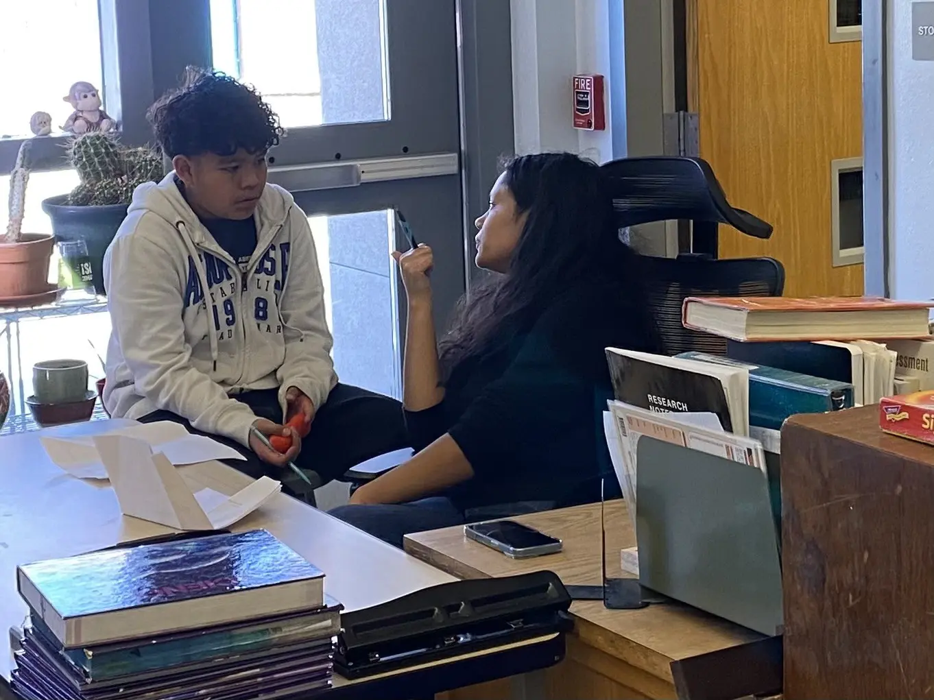 Courtesy photo: Tutor helping student understand scholarship application questions