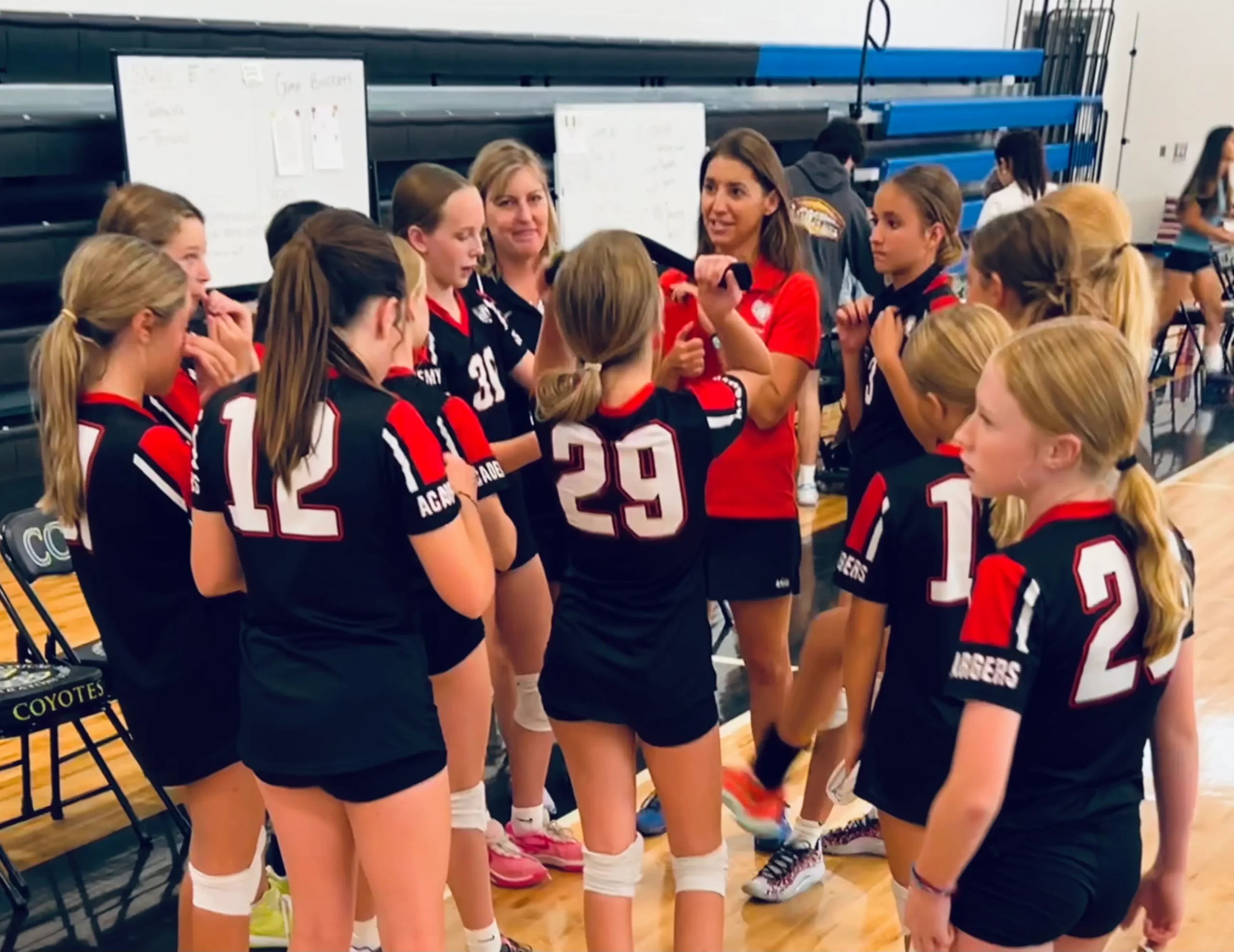 Coaches Pamela and Marcie bring the team in for a time-out